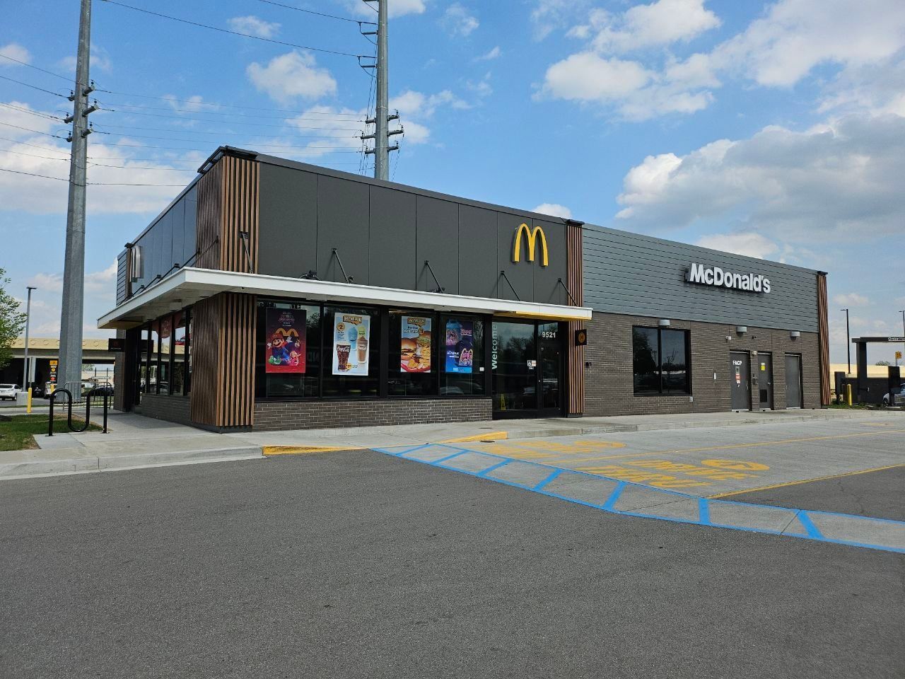 McDonald's and Acorns restaurant exterior in a parking lot on a sunny day