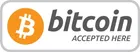 Bitcoin accepted here sign with orange Bitcoin logo and gray text on a white background